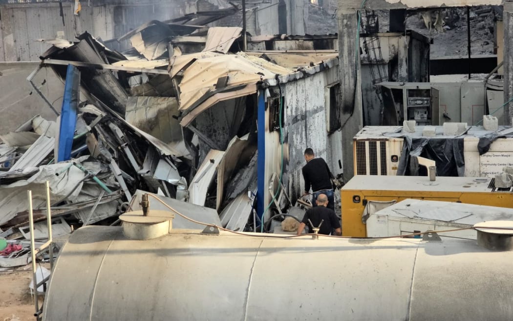 File photo. People check damage outside the Kamal Adwan hospital in Beit Lahia in the northern Gaza Strip, following Israeli strikes around the medical complex on 6 December 2024.