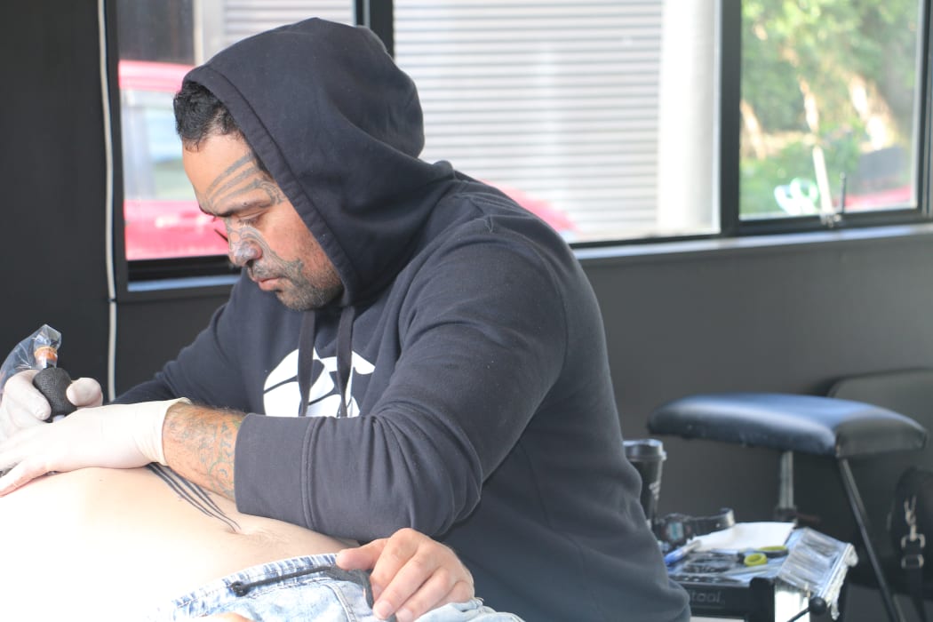 Stu Mcdonald works on a chest piece at his home based studio.