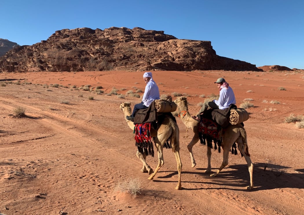 Andrew Bayly and his son Dan on camels.