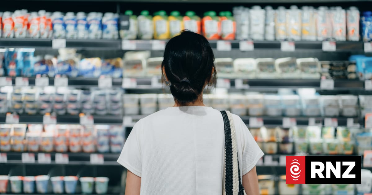 Rear view of young person doing grocery shopping