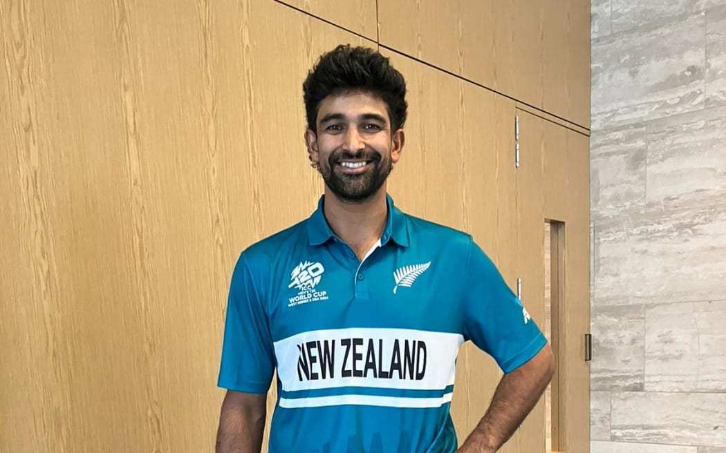Black Cap Ish Sodhi in the new teal uniform.