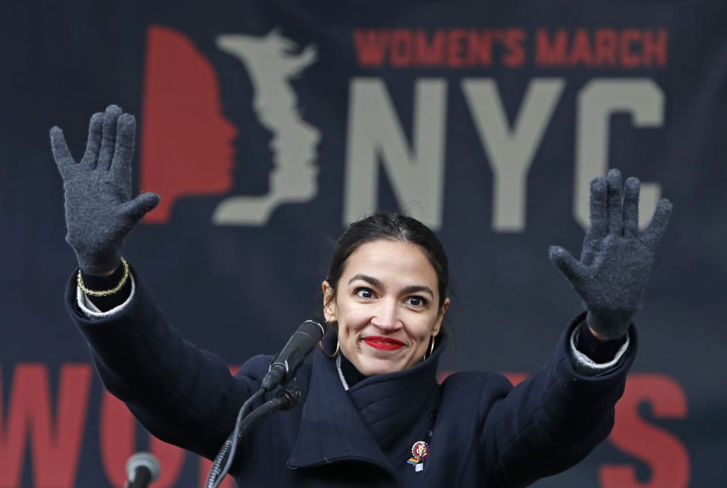 U.S. Rep. Alexandria Ocasio-Cortez, D-New York, waves to the crowd after speaking at Women's Unity Rally organized by Women's March NYC at Foley Square in Lower Manhattan in New York. (AP Photo/Kathy Willens, File)