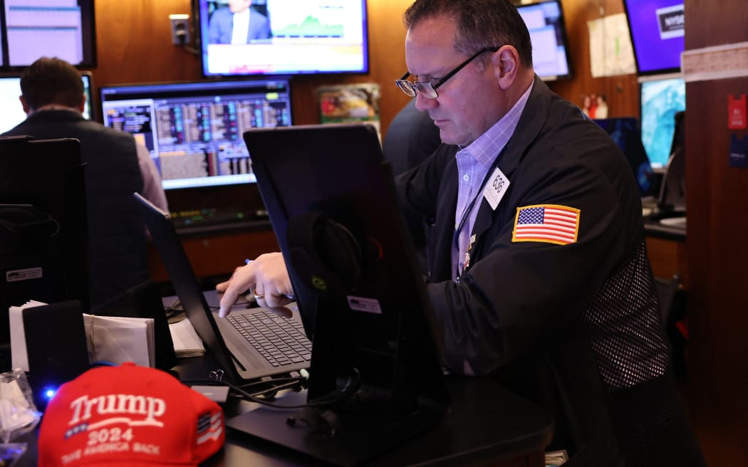 NEW YORK, NEW YORK - NOVEMBER 07: Traders work on the floor of the New York Stock Exchange during the morning trading on November 07, 2024 in New York City. Stocks rose slightly at the opening, a day after the Dow Jones closed up over 1,500 points following former President Donald Trump's win in the 2024 presidential election. The gain was the market's biggest jump in two years. The S&P 500 and Nasdaq Composite also closed at all time highs. The market is also expecting an interest-rate decision from the Federal Reserve Bank later today.   Michael M. Santiago/Getty Images/AFP (Photo by Michael M. Santiago / GETTY IMAGES NORTH AMERICA / Getty Images via AFP)
