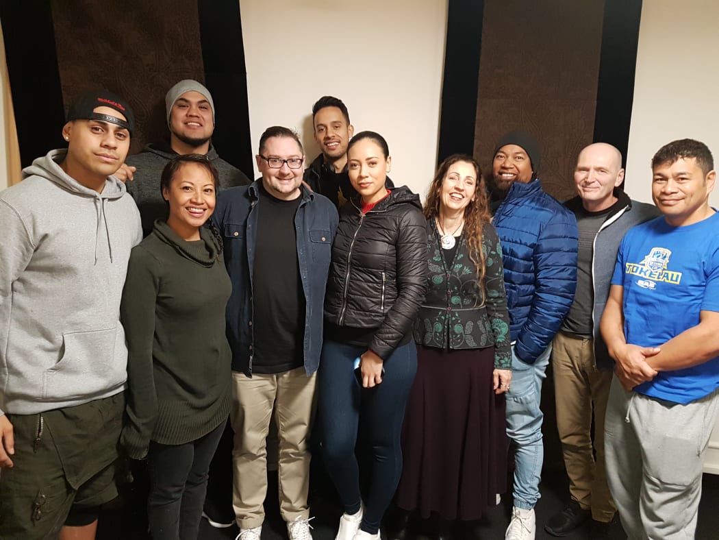 Members of Te Vaka, with Orchestra Wellington Marketing Manager Marek Peszynski.