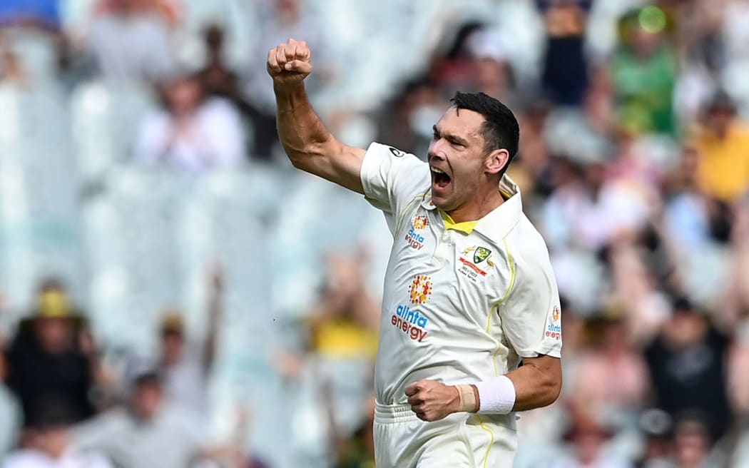 Scott Boland of Australia celebrates.