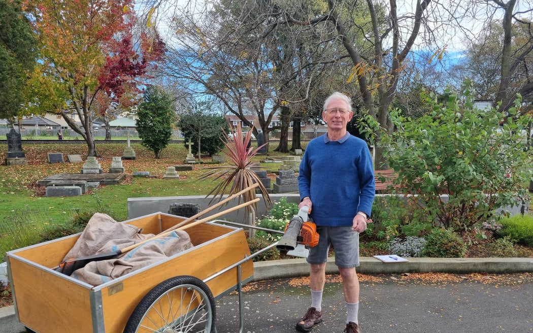 Volunteer Julian Dart cleaning his local graveyard.