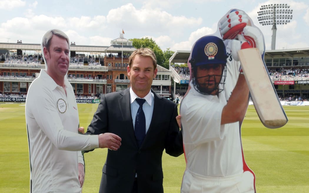 Shane Warne meets himself and opposing captain Sachin Tendulkar (to publicise an MCC cricket match in 2014.