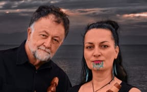 Musicians Bob Bickerton and Ariana Tikao hold taonga puoro