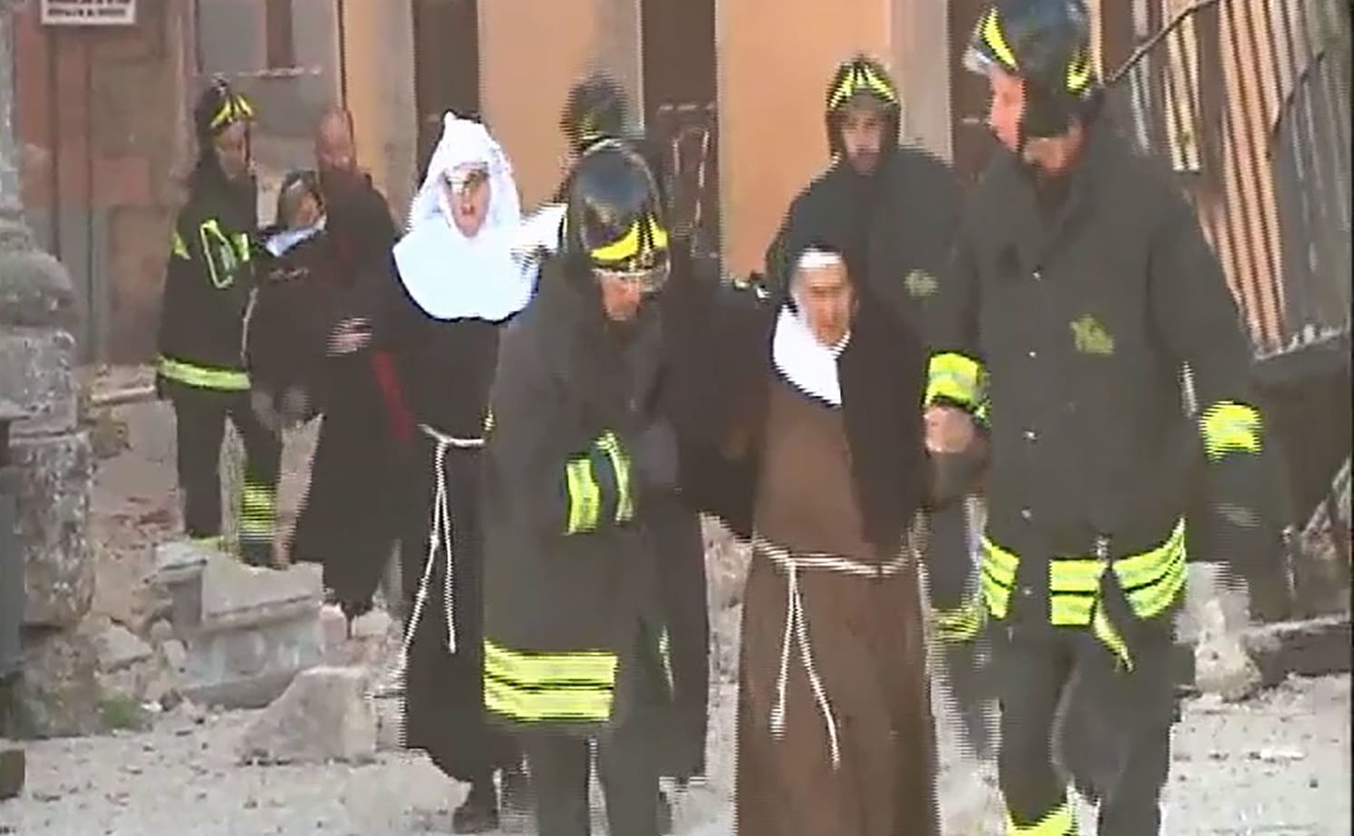 Italian emergency workers help nuns in Norcia after the 6.6 earthquake.