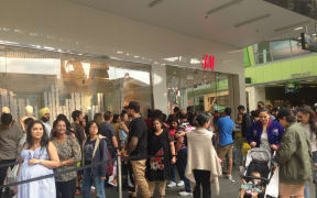 Long queues of shoppers waited to get into clothing retailer H & M at Auckland's Sylvia Park Mall.