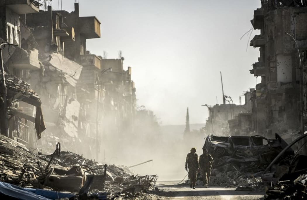 Fighters from the Syrian Democratic Forces (SDF) in Raqqa after a Kurdish-led force expelled Islamic State (IS) group fighters.