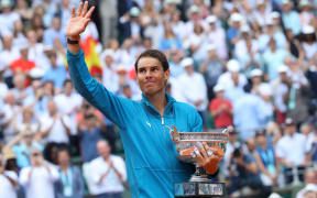 Rafael Nadal celebrating 11th French Open Title with trophy