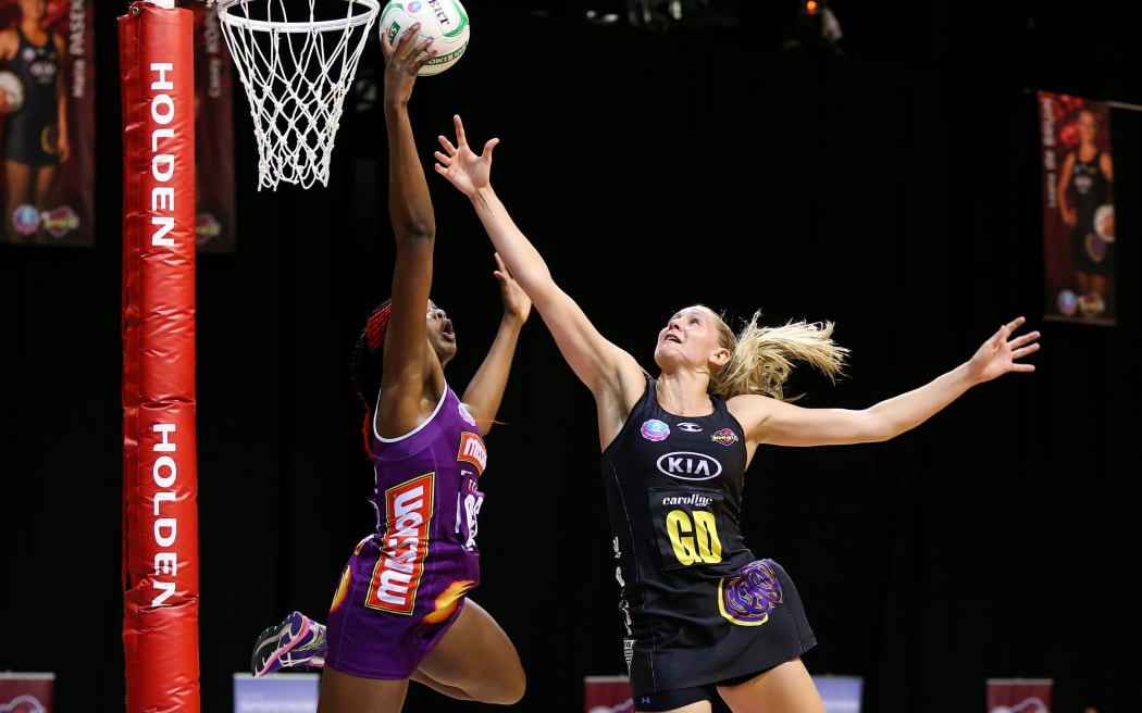 Queensland Firebird's Romelda Aiken and Waikato BOP Magic captain Casey Kopua in action during the ANZ Championship netball match - Waikato BOP Magic v Queensland Firebirds at Claudelands Arena, Hamilton, New Zealand on Monday 2 June 2014.  Photo:  Bruce Lim / www.photosport.co.nz