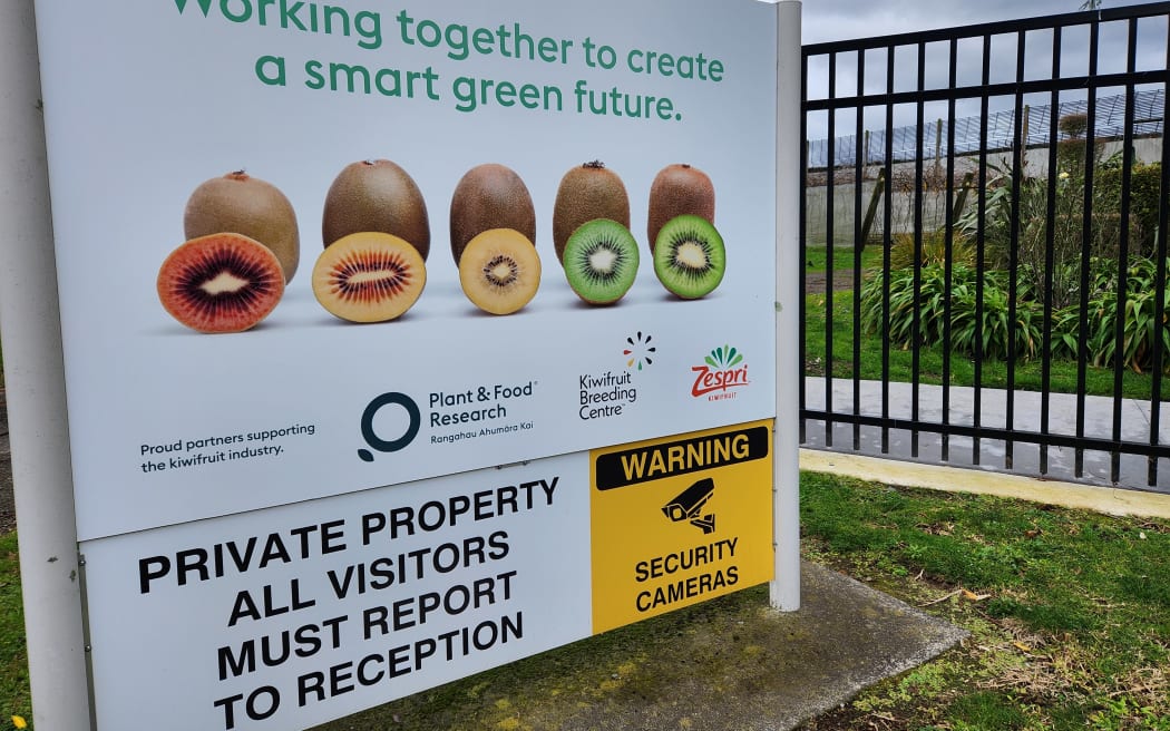 Sign advertising the Kiwifruit Breeding Centre and security messages