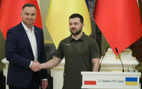 KYIV, UKRAINE - MAY 22, 2022 - President of Ukraine Volodymyr Zelenskyy (R) shakes hands with President of the Republic of Poland Andrzej Duda during their joint press conference in Kyiv, capital of Ukraine. This photo cannot be distributed in the Russian Federation. NO USE RUSSIA. NO USE BELARUS. (Photo by Pavlo_Bagmut / NurPhoto / NurPhoto via AFP)