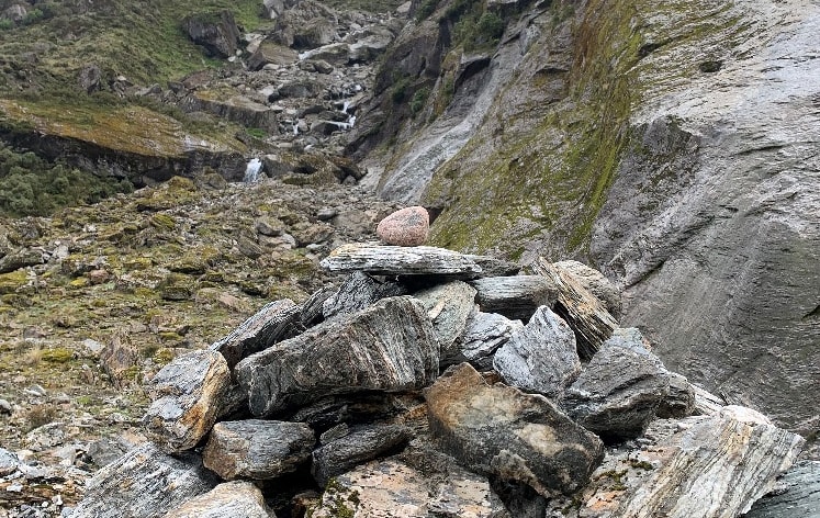 The cairn put together by the search team with Swedish granite on top.
