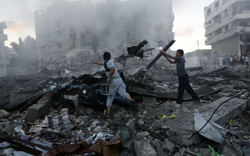 Gaza authorities said Israeli forces shelled a shelter at a UN-run school.