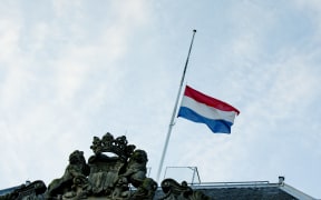 The Dutch flag flies half mast on the Defence building in The Hague.