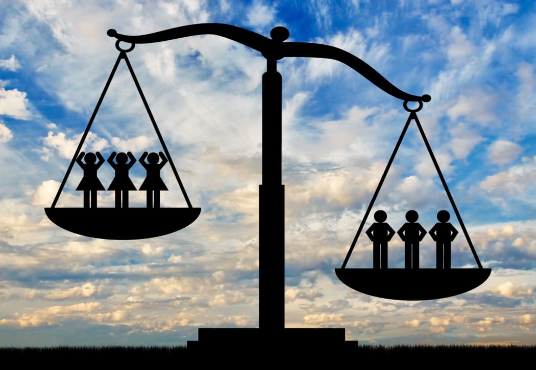 70672660 - men and women on scales. concept of gender inequality