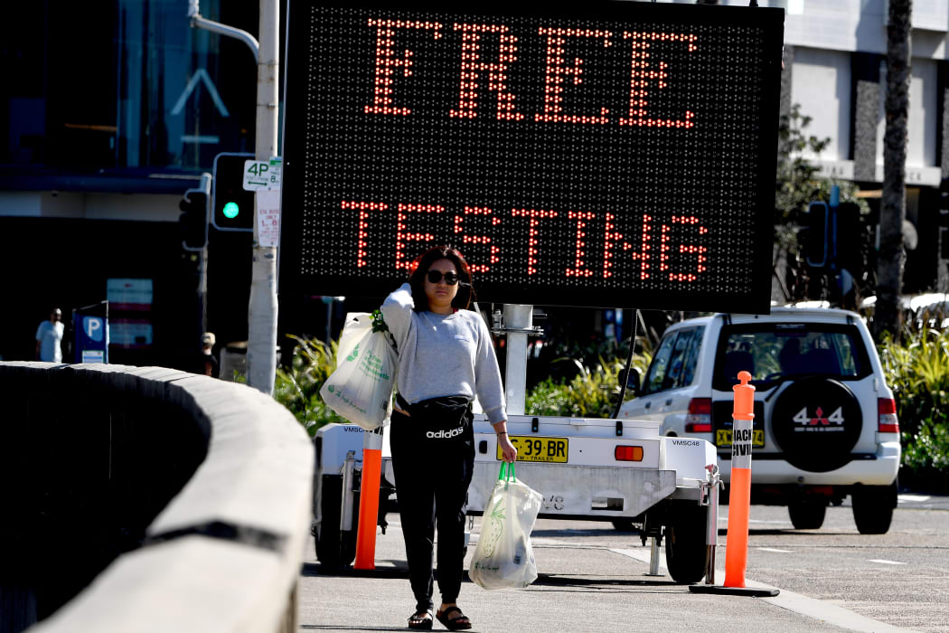 An electronic screen advertises free COVID-19 testing being offered at Bondi Beach in Sydney today.