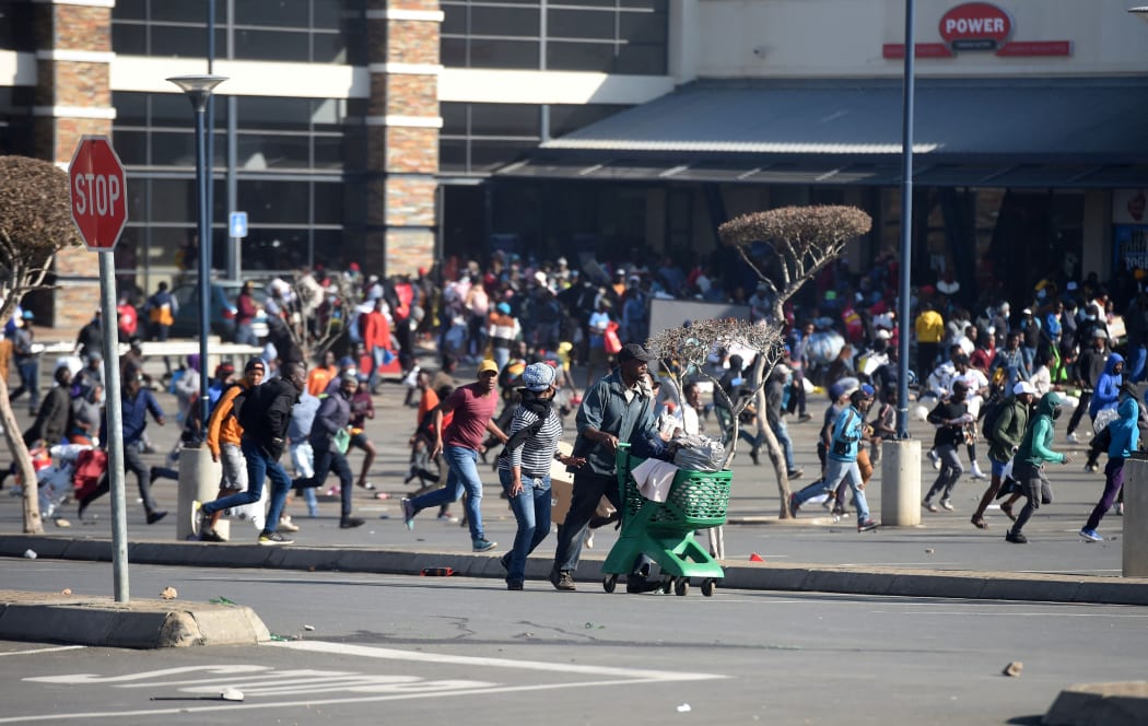 People protest against the imprisonment of former president Jacob Zuma, in Johannesburg, South Africa on 12 July, 2021.