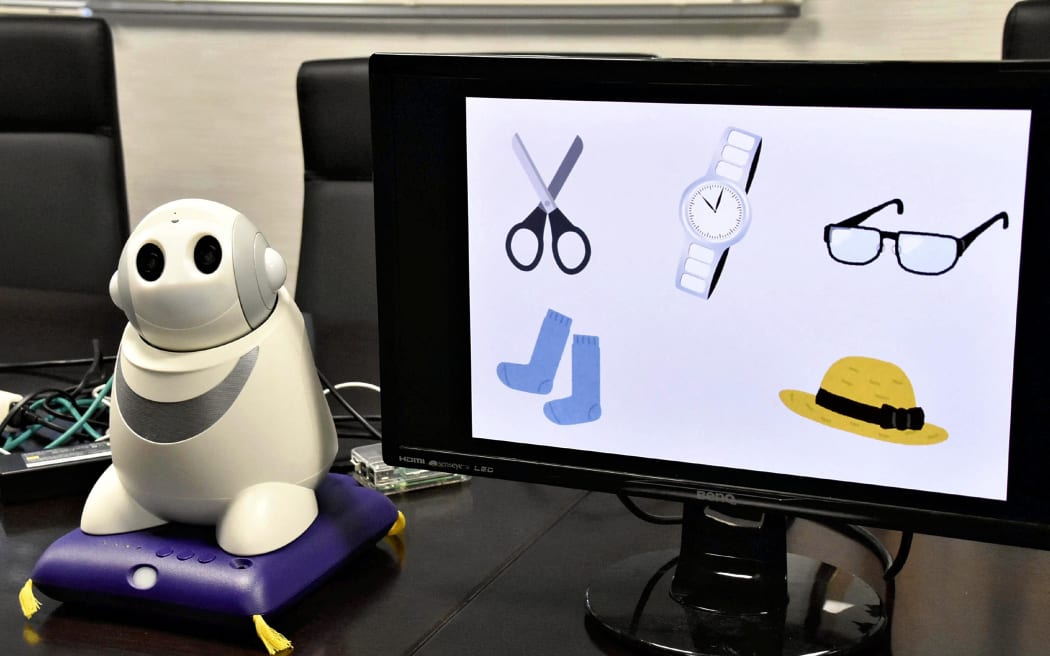 A communication robot to inspect the dementia is shown at Nagasaki University in Nagasaki on Dec. 14, 2018. University announced that they developed the system to inspect dementia using home use communication robot that can speak using AI and started its demonstration test. The test is scheduled to finish in next February and make improvement after comparing with results by medical specialist.( The Yomiuri Shimbun ) (Photo by Yohei Himeno / Yomiuri / The Yomiuri Shimbun via AFP)