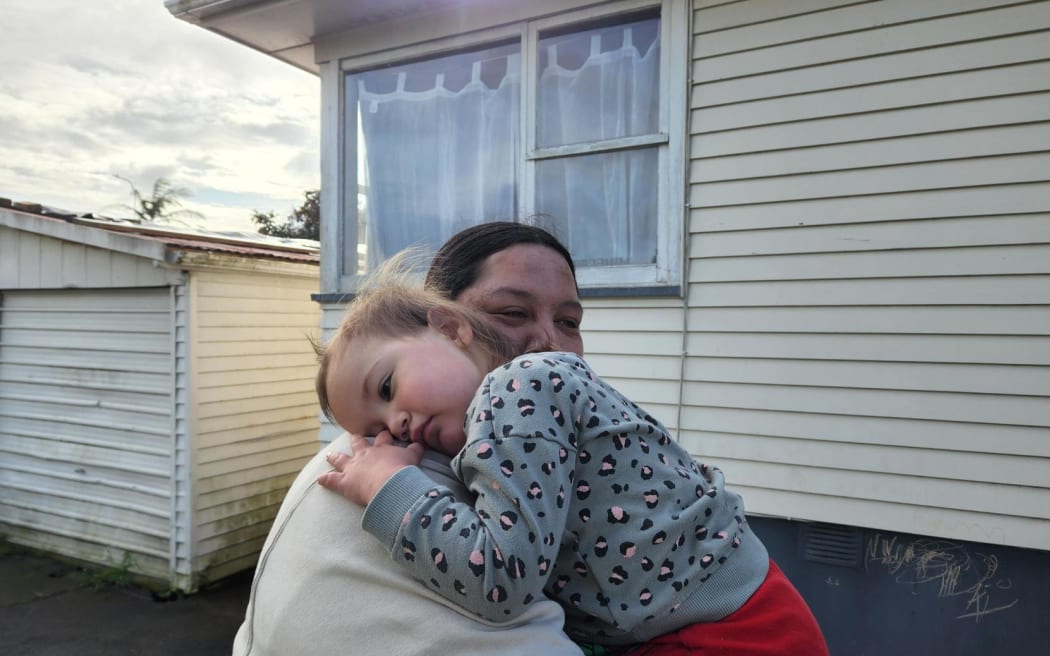 Two-year-old West Auckland toddler Willow is cuddled by her mum, Waimirirangi Rudolph. Willow was reunited with her family on Sunday night after going missing from her home on Zodiac Street in Henderson earlier in the afternoon. She was found by a member of the public wandering on Universal Drive and her disappearance sparked a massive search, involving hundreds of locals.
