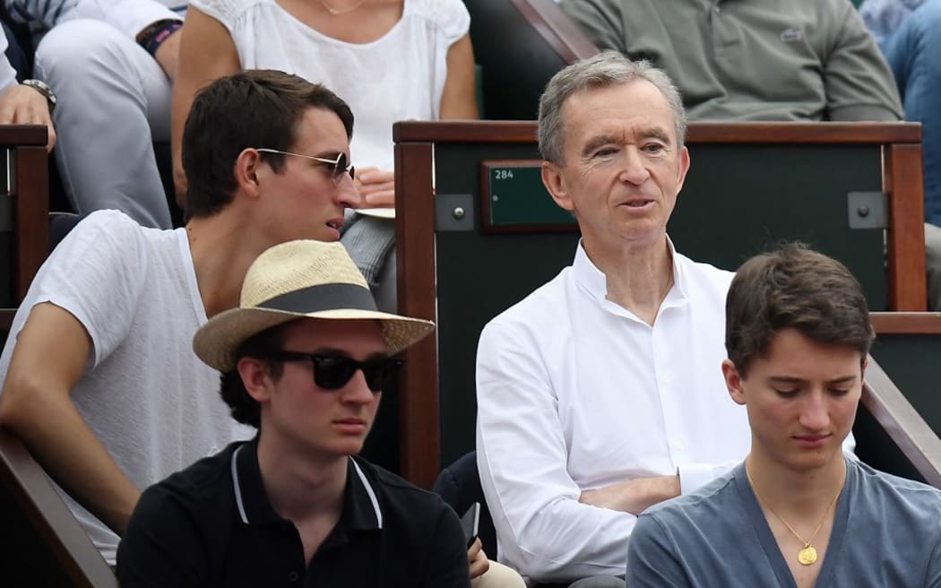 French Luxury group Chairman and CEO Bernard Arnault (up, R) and his sons Alexandre, Frederic (down, L) and Jean (down, R).