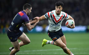 Nick Meaney of the Storm (left) and Joseph Suaalii of the Roosters during the NRL Preliminary Final match between the Melbourne Storm and the Sydney Roosters at AAMI Park Friday, September 27, 2024. (AAP Image/Joel Carrett/Photosport)