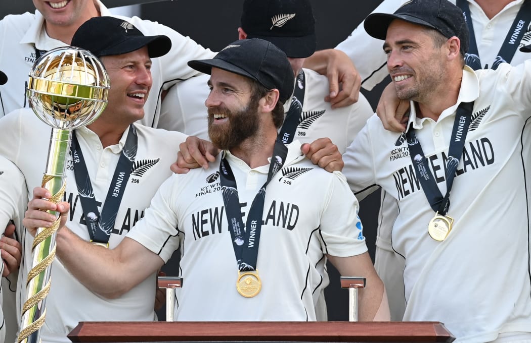New Zealand's captain Kane Williamson (C) holds the winner's Mace as New Zealand players celebrate victory on the final day of the ICC World Test Championship Final between New Zealand and India at the Ageas Bowl in Southampton, southwest England on June 23, 2021.