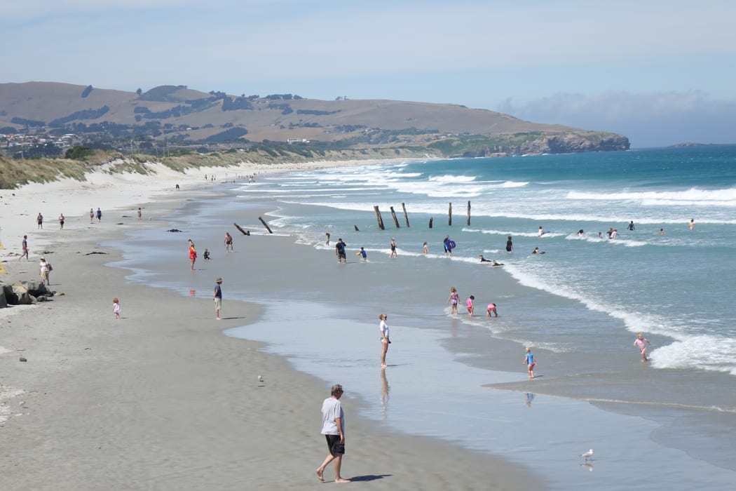 Dunedin residents took to St Clair Beach to get out of the heat of the day.