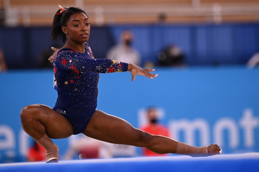 USA's Simone Biles competes in the floor event of the artistic gymnastic women's qualification during the Tokyo 2020 Olympic Games at the Ariake Gymnastics Centre in Tokyo.