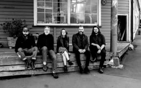 Candice Milner with her band.