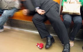 Now that's manspreading. Salaryman asleep on the Tokyo Subway