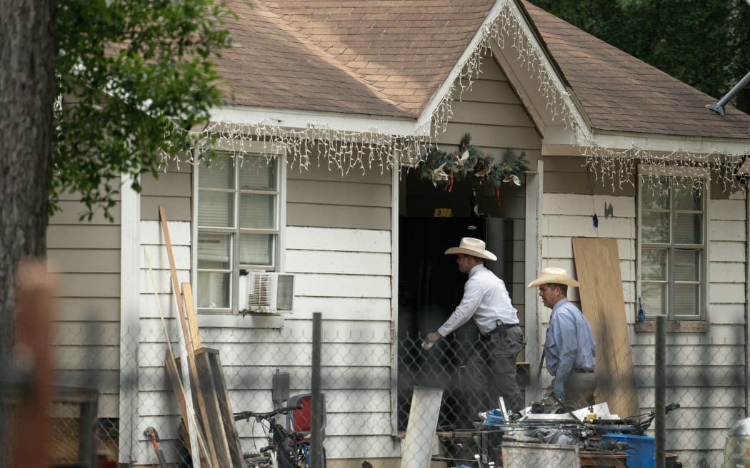 Law enforcement respond to a crime scene where five people, including an 8-year-old child, were killed after a shooting inside a home in Cleveland, Texas on 29 April, 2023. The alleged gunman, who is not yet in custody, used an AR-15 style rifle to shoot his neighbours.