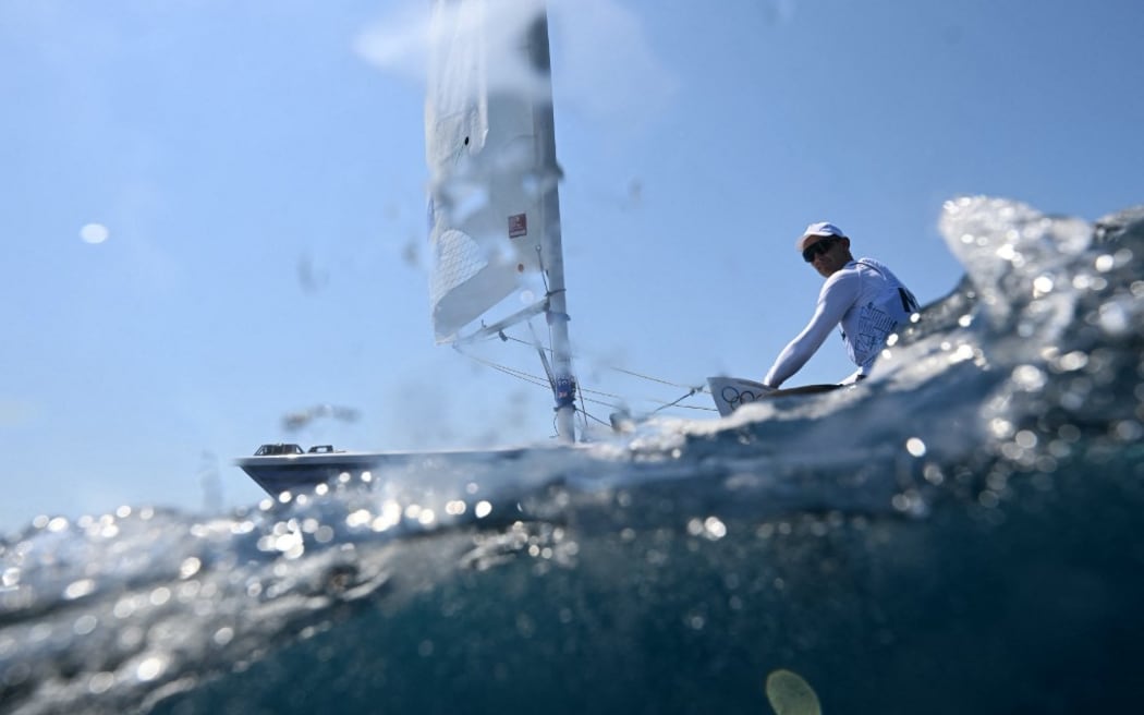 New Zealand's Thomas Saunders competes in race 1 of the men’s ILCA 7 single-handed dinghy event during the Paris 2024 Olympic Games sailing competition at the Roucas-Blanc Marina in Marseille on August 1, 2024. (Photo by Christophe SIMON / AFP)