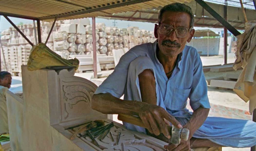 A craftsman carves pieces for a new quick-erect Hindu temple planned for the Ayodhya Babri Masjid site. Ayodhya, UP 2003