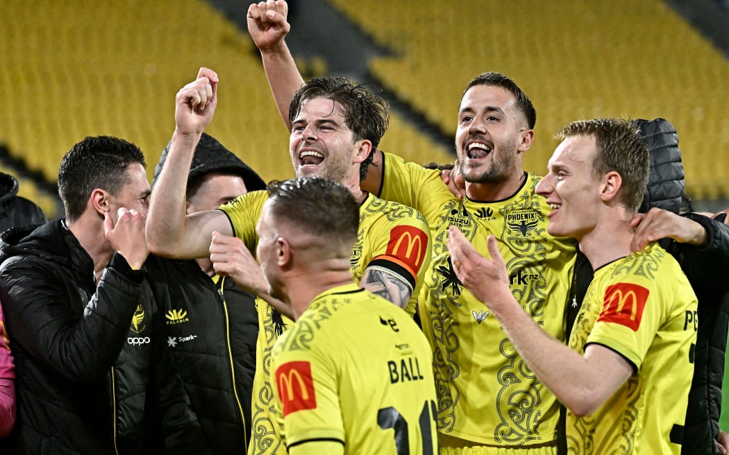 Phoenix players react to their win in the A-League, 2024