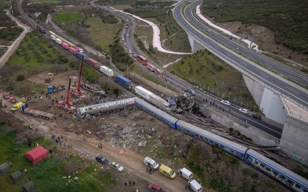 This aerial drone photograph taken on 1 March 2023, shows emergency crews searching wreckage after a train crash in the Tempi Valley near Larissa, Greece.