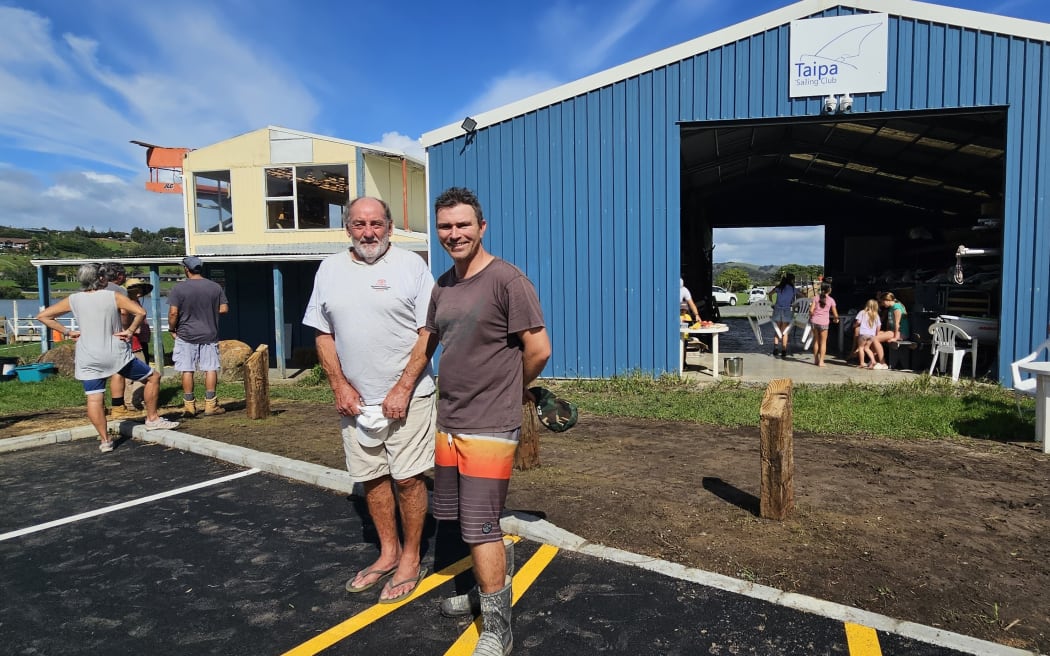 Taipā Sailing Club patron Paddy Simms, left, and Lester Bridson during a post-cyclone working bee.