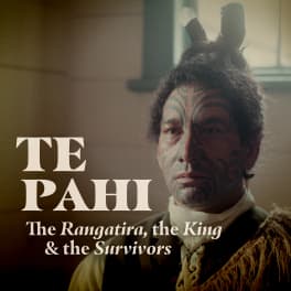 Close up of an actor dressed as Te Pahi including korowai, huia feathers and tāmoko. The text reads “Te Pahi. The Rangatira, the King & the survivors”