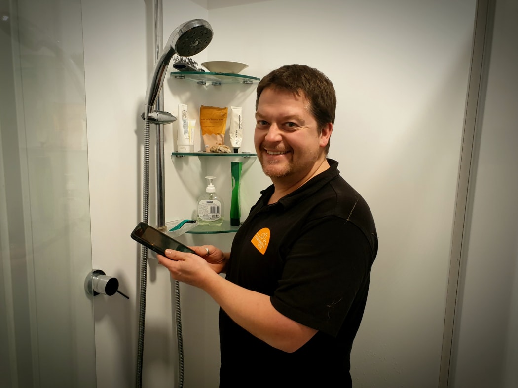 Sustainability Trust home assessor Karl Wheddon says phones in the shower are hampering efforts to cut energy and water usage