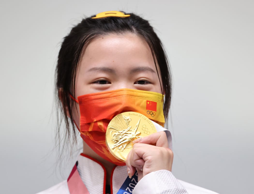 Yang Qian of China celebrates after winning Shooting 10m Air Rifle Women's Final at Asaka Shooting in Saitama Prefecture on July 24, 2021.