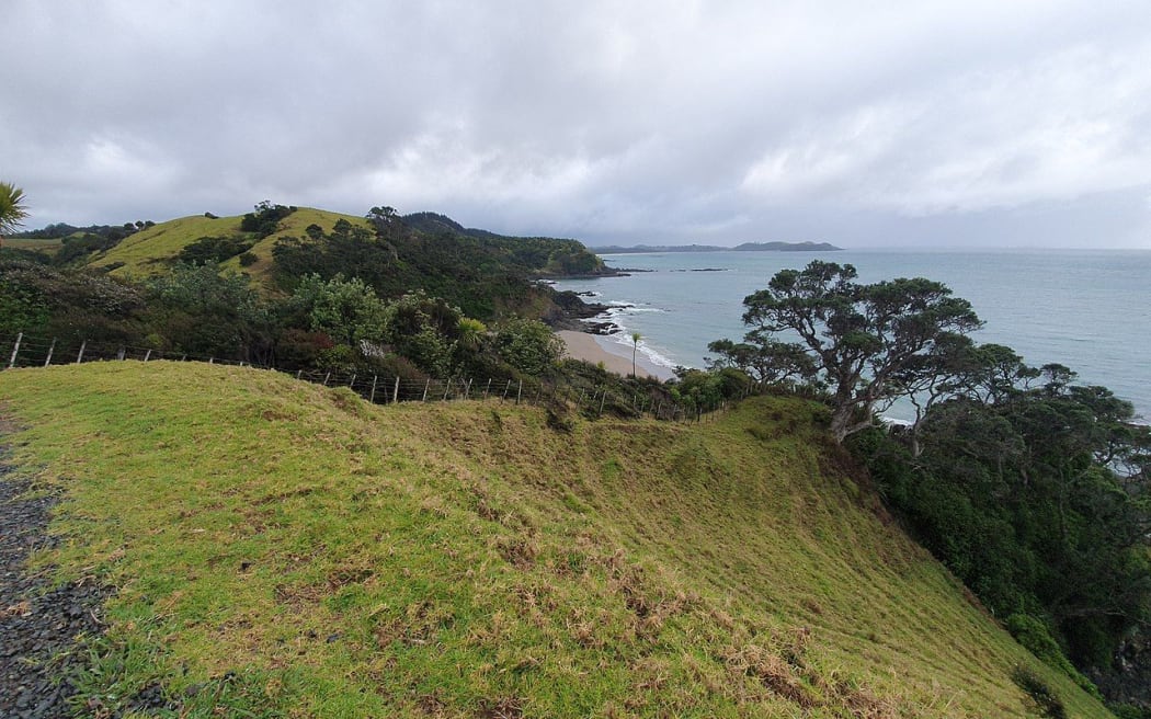 View from the Whananaki Coastal Walk across Sandy Bay to Motutara Point.