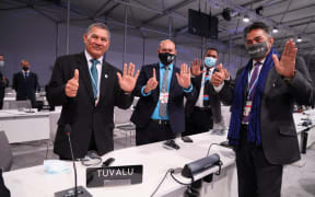 Tuvalu delegation to COP26, including Prime Minister Natano, with Ambassador Luteru.