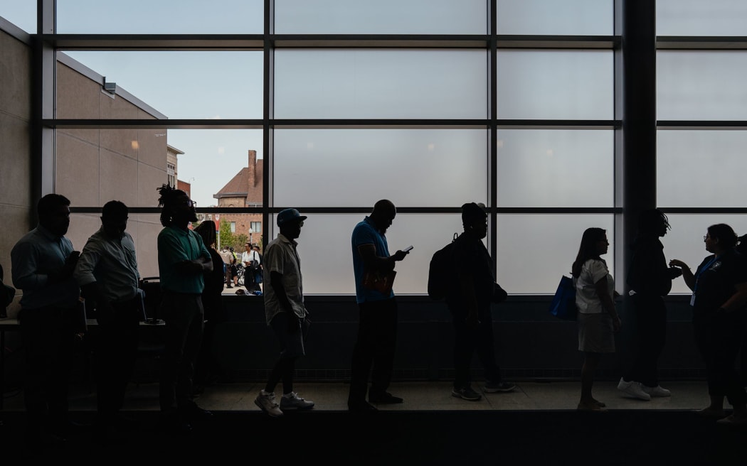 Job seekers wait to enter an auditorium for a job fair in Chicago on June 26.
Mandatory Credit:	Jamie Kelter Davis/Bloomberg/Getty Images via CNN Newsource