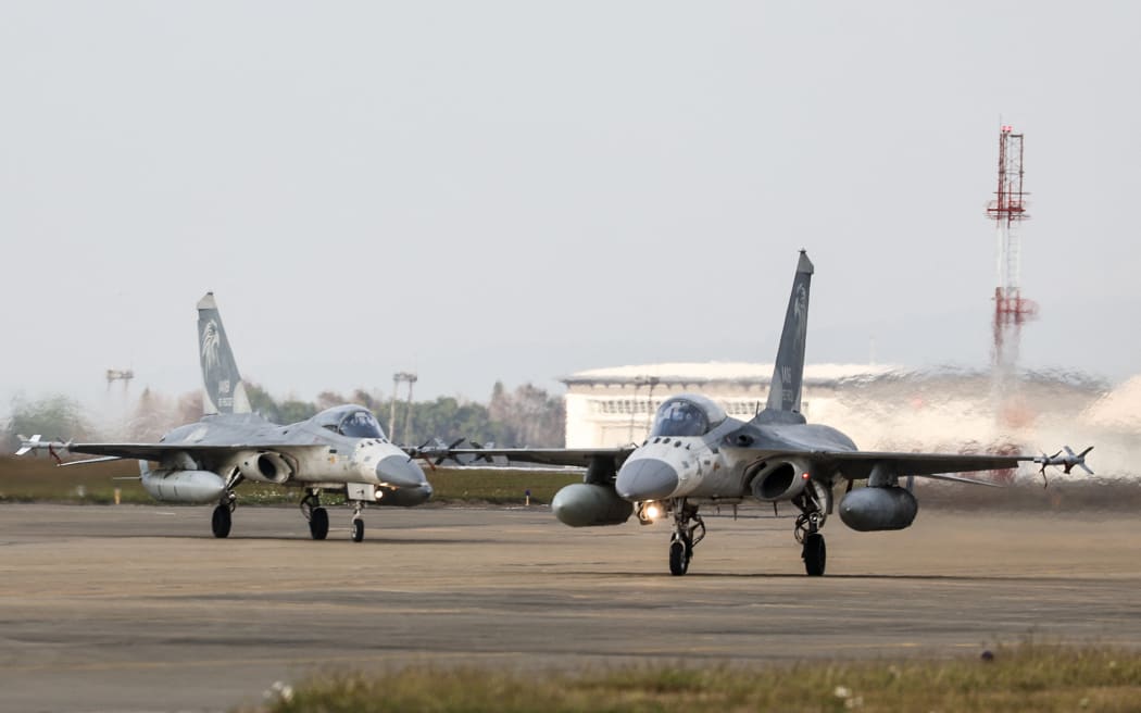 (FILES) Taiwanese air force Indigenous Defense Fighter aircraft taxi for take-off during a scramble as part of a combat readiness exercise at the Ching Chuan Kang Air Base in Taichung on January 7, 2025. Taiwan dispatched forces on February 26, 2025 in response to "live-fire" drills conducted by China off the self-ruled island, Taipei's defence ministry said, condemning the exercises as dangerous.