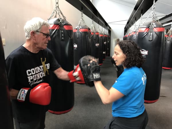 Lisa Gombinsky, neuro and rehab specialised PT and founder of Counterpunch working with a client in Auckland.