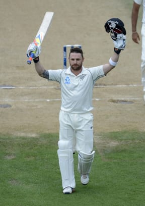 Brendon McCullum celebrates making history