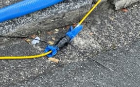 Hadfield Street, cable water proofing with tape and rubber glove
